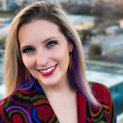 Dr. Melanie Wilcox smiling outside in colorful jacket